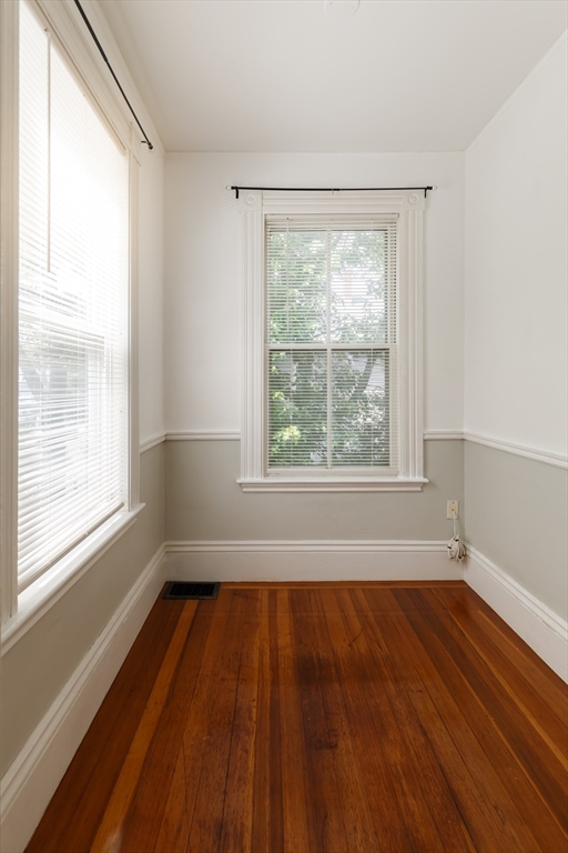 327 Lafayette Street, Unit 2 Salem, MA 01970 - Photo 20 of 22 a view of an empty room with wooden floor and a window