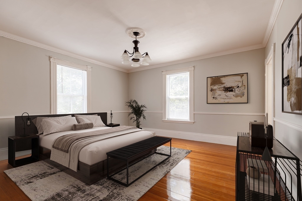 327 Lafayette Street, Unit 2 Salem, MA 01970 - Photo 5 of 22 a bedroom with bed and wooden floor