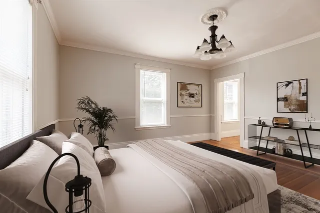 a bedroom with a bed and window