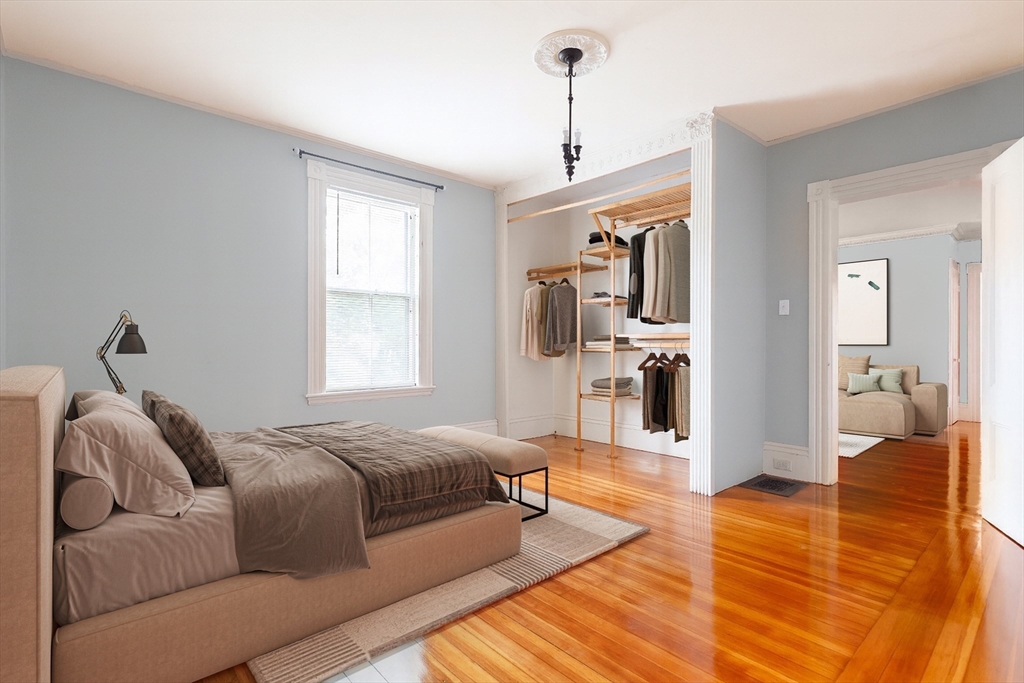 327 Lafayette Street, Unit 2 Salem, MA 01970 - Photo 8 of 22 a spacious bedroom with a bed and wooden floor