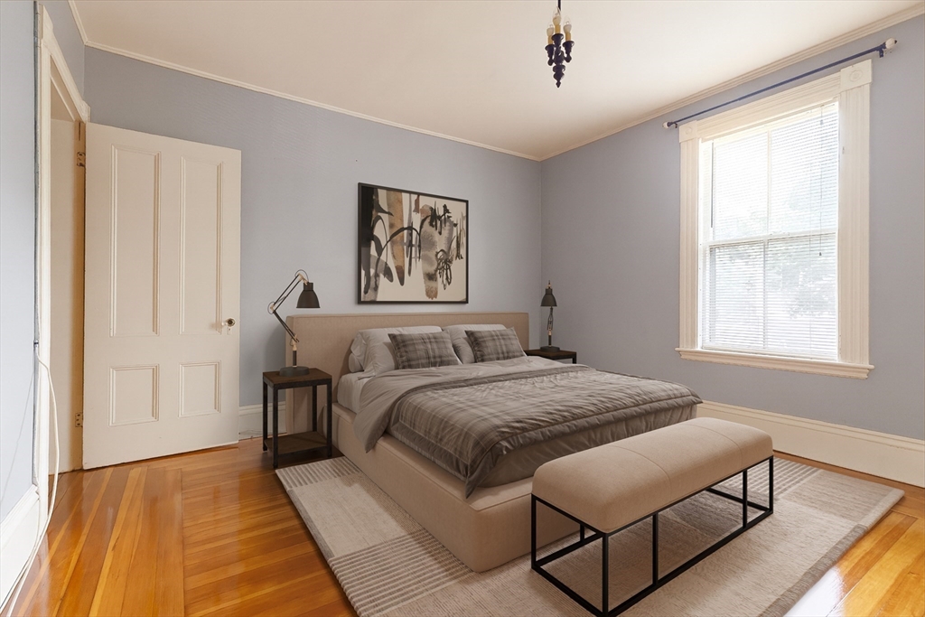 327 Lafayette Street, Unit 2 Salem, MA 01970 - Photo 9 of 22 a bed room with a bed and a painting