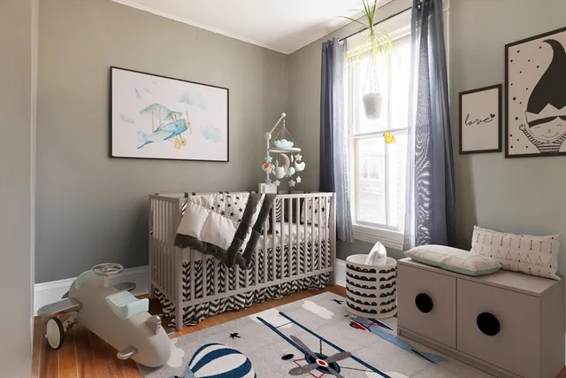 a bedroom with furniture and a window