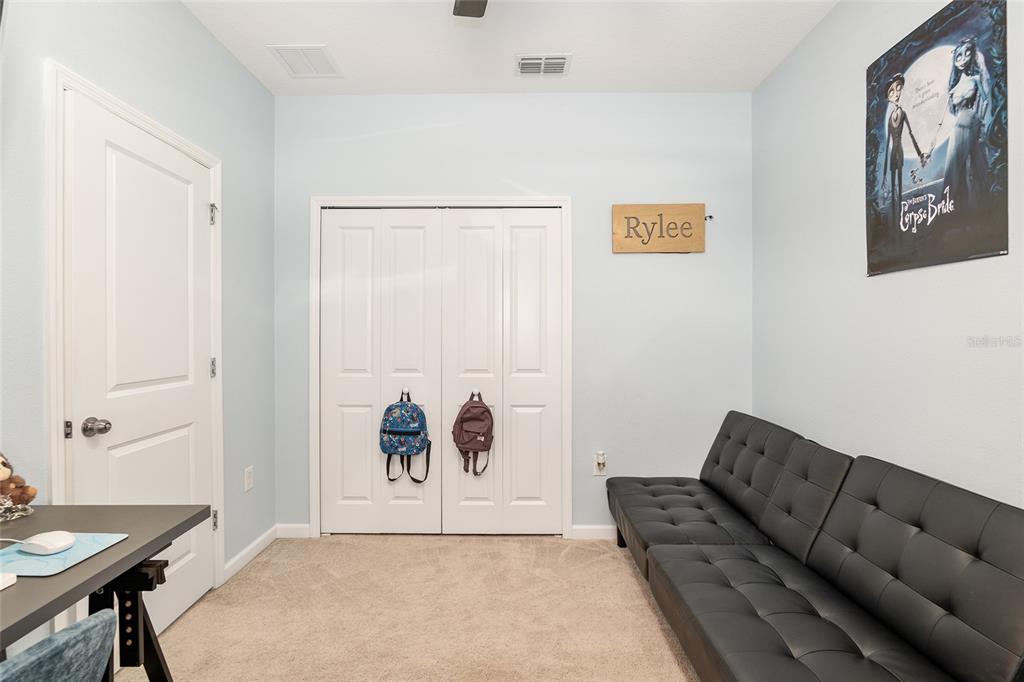 5688 Southwest 92nd Place Ocala, FL 34476 - Photo 39 of 54 a living room with furniture and painting on the wall