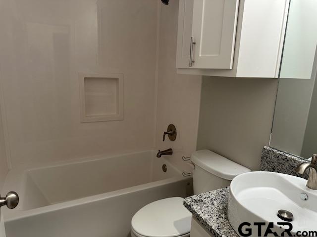 16461 County Road 178, Unit 2 Tyler, TX 75703 - Photo 16 of 16 a bathroom with a toilet a sink and bathtub