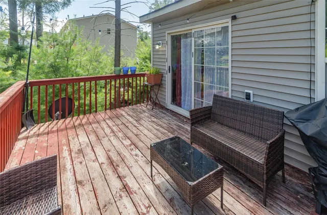 a view of balcony with wooden floor