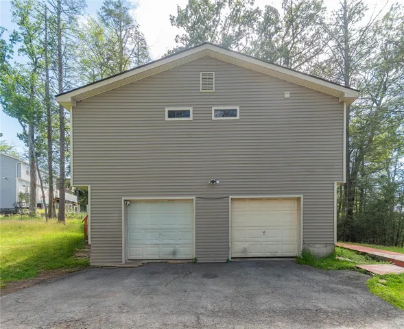 a front view of a house with yard