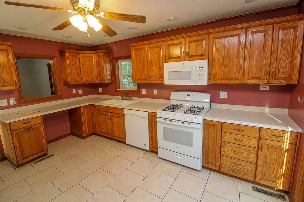 428 Sarver Road Sarver, PA 16055 - Photo 6 of 25 a kitchen with a stove sink and cabinets