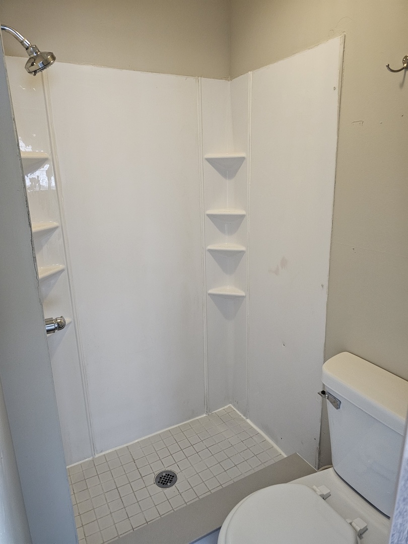 1114 25th Street Moline, IL 61265 - Photo 12 of 18 a bathroom with a toilet and a shower