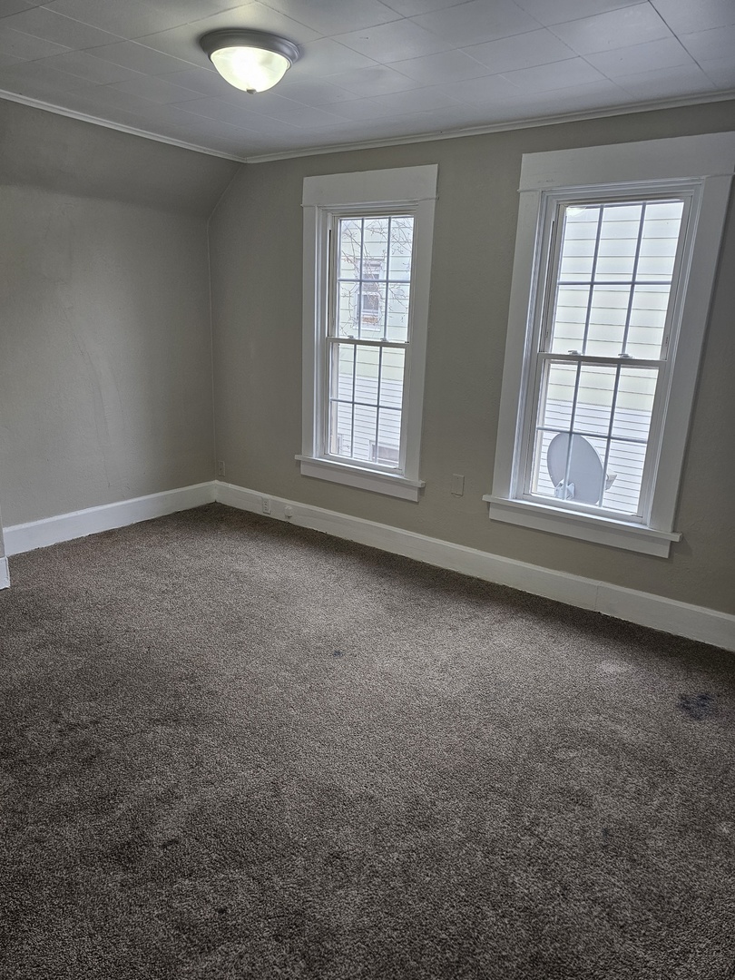 1114 25th Street Moline, IL 61265 - Photo 13 of 18 an empty room with a empty space and windows
