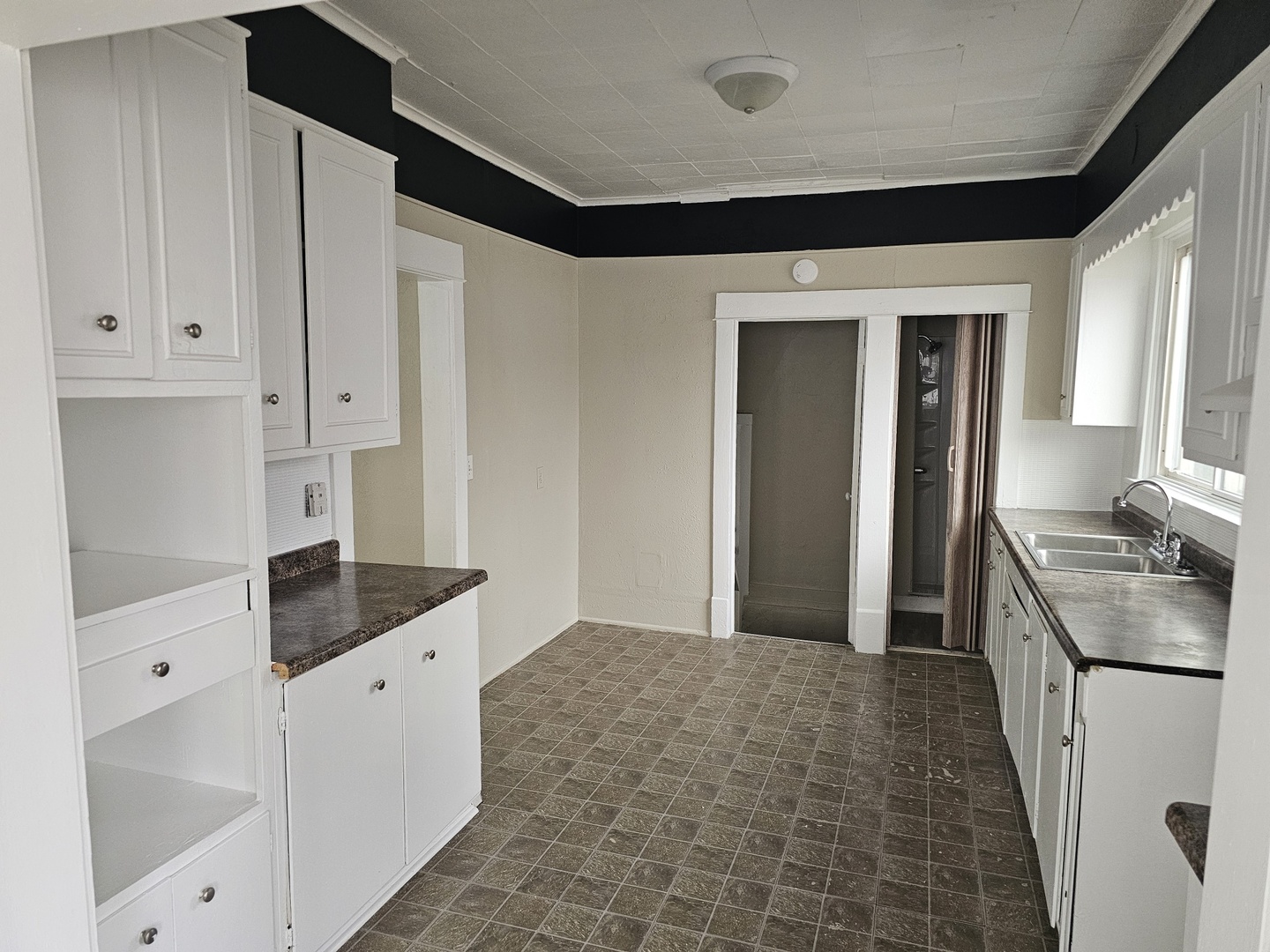 1114 25th Street Moline, IL 61265 - Photo 10 of 18 a kitchen with granite countertop a sink and a stove top oven