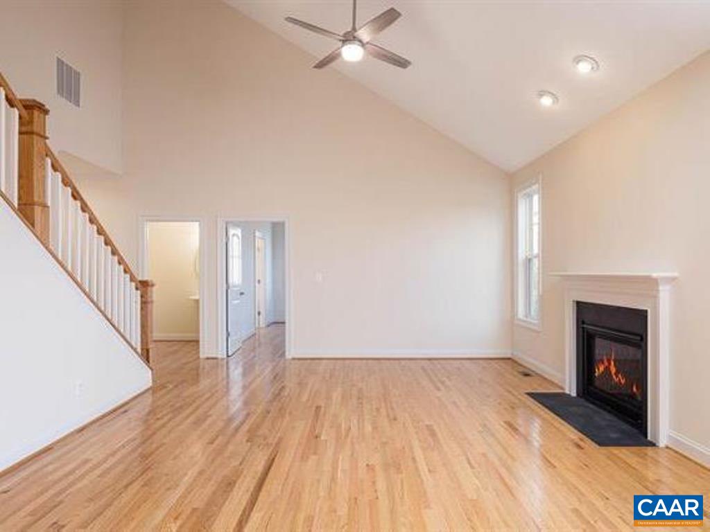 6 Ridgeview Drive Ruckersville, VA 22968 - Photo 15 of 32 a view of empty room with wooden floor and fireplace