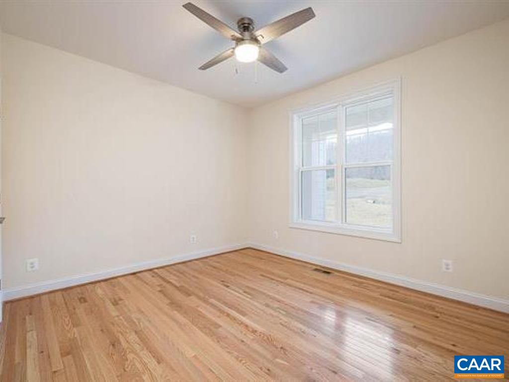 6 Ridgeview Drive Ruckersville, VA 22968 - Photo 23 of 32 wooden floor in an empty room with a window