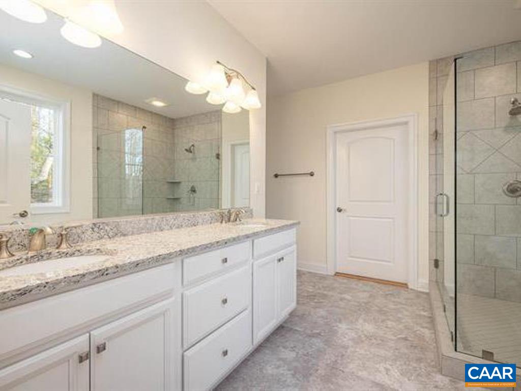 6 Ridgeview Drive Ruckersville, VA 22968 - Photo 26 of 32 a bathroom with a granite countertop sink mirror and double