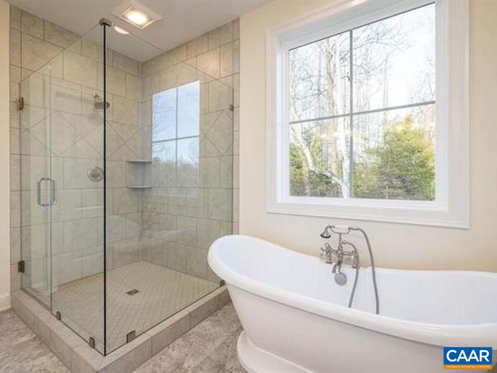 6 Ridgeview Drive Ruckersville, VA 22968 - Photo 27 of 32 a white bath tub sitting next to a shower
