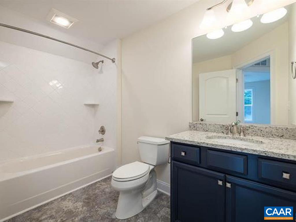 6 Ridgeview Drive Ruckersville, VA 22968 - Photo 30 of 32 a bathroom with a granite countertop sink a toilet and shower