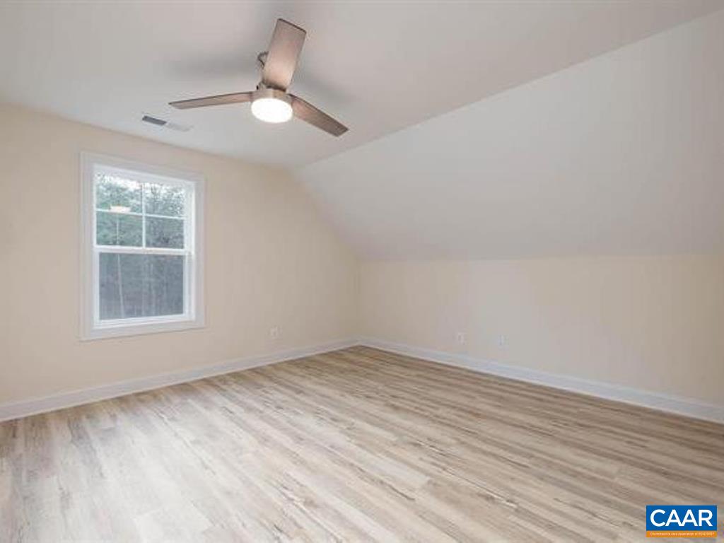 6 Ridgeview Drive Ruckersville, VA 22968 - Photo 31 of 32 an empty room with wooden floor and windows