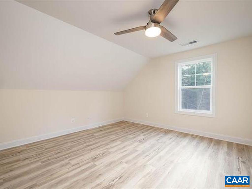 6 Ridgeview Drive Ruckersville, VA 22968 - Photo 32 of 32 an empty room with a window and a ceiling fan