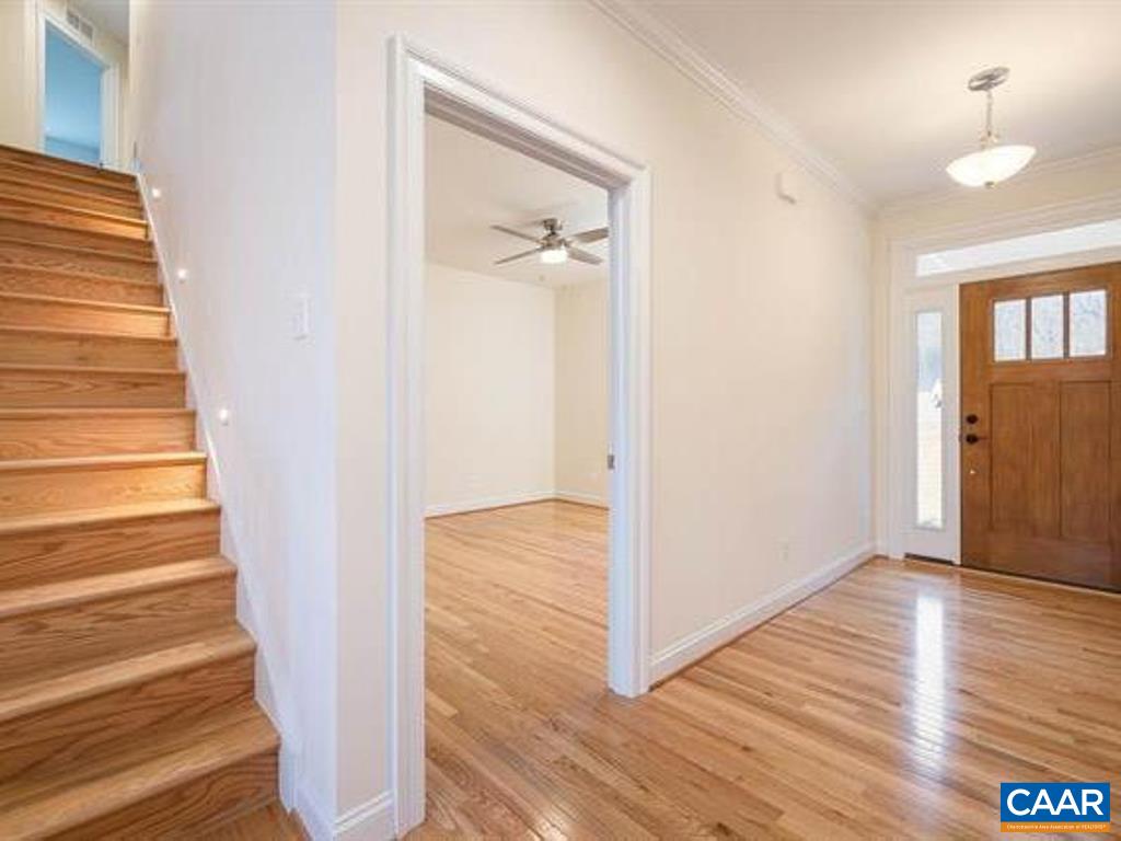 6 Ridgeview Drive Ruckersville, VA 22968 - Photo 10 of 32 a view of a hallway with wooden floor and staircase