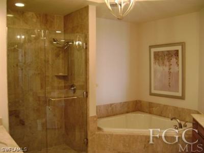 2090 West First Street, Unit 2007 Fort Myers, FL 33901 - Photo 8 of 10 a bath tub sitting next to a bathroom