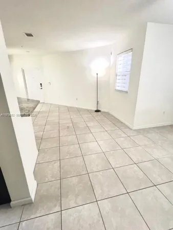 a view of an empty room and entryway