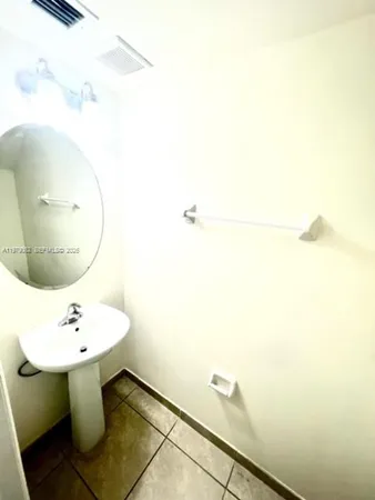 a bathroom with a sink and mirror