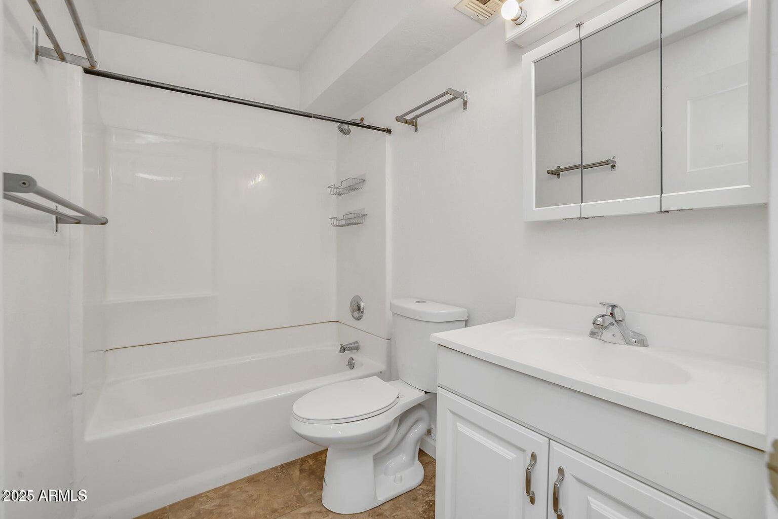 1526 West Huntington Drive Tempe, AZ 85282 - Photo 15 of 17 a bathroom with a sink a toilet and shower