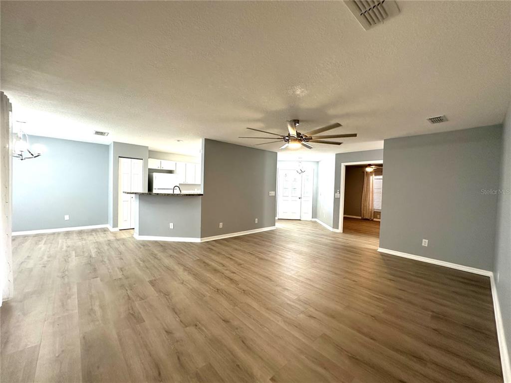 9706 Southwest 92nd Place Road Ocala, FL 34481 - Photo 2 of 82 wooden floor in an empty room with a window