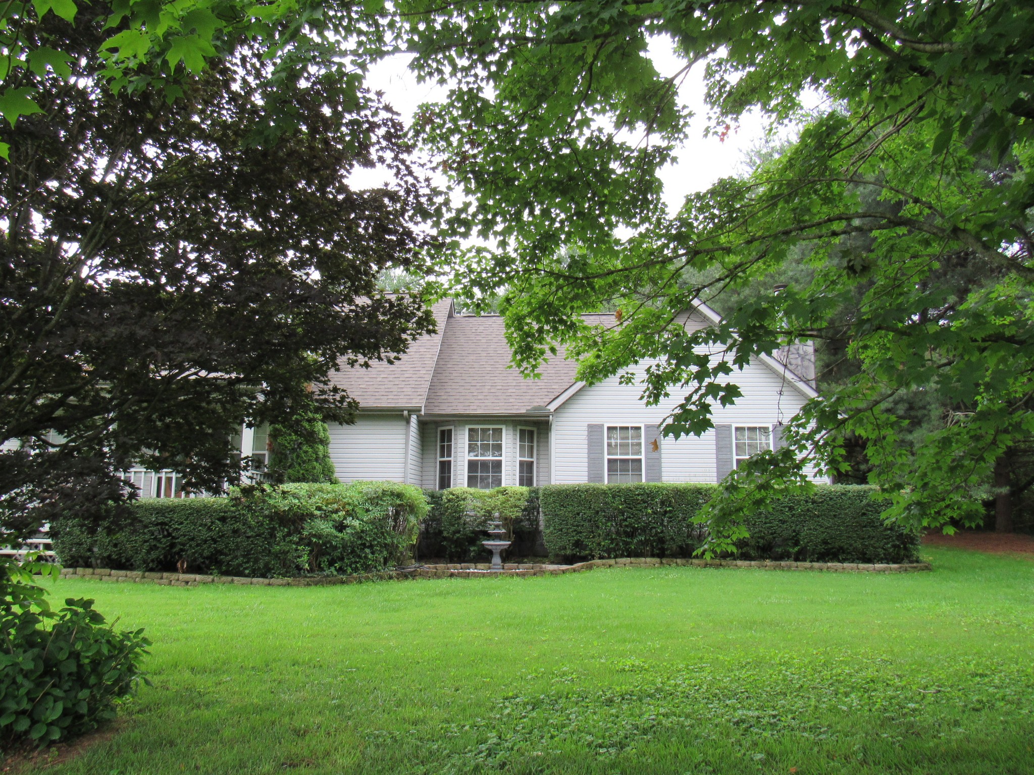1040 Harpo Road Manchester, TN 37355 - Photo 3 of 47 a front view of a house with a yard
