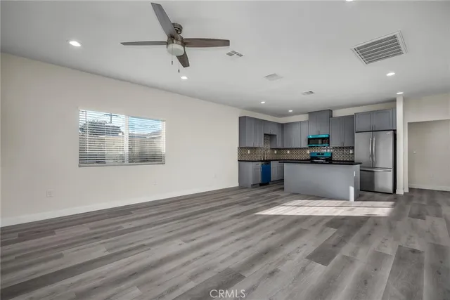 a view of kitchen with wooden floor and window