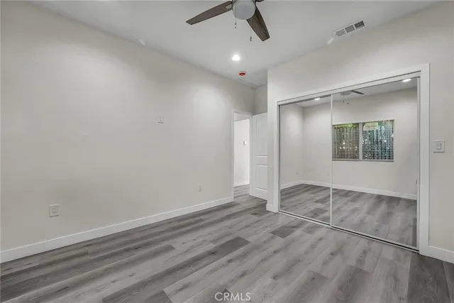 an empty room with a empty space and windows