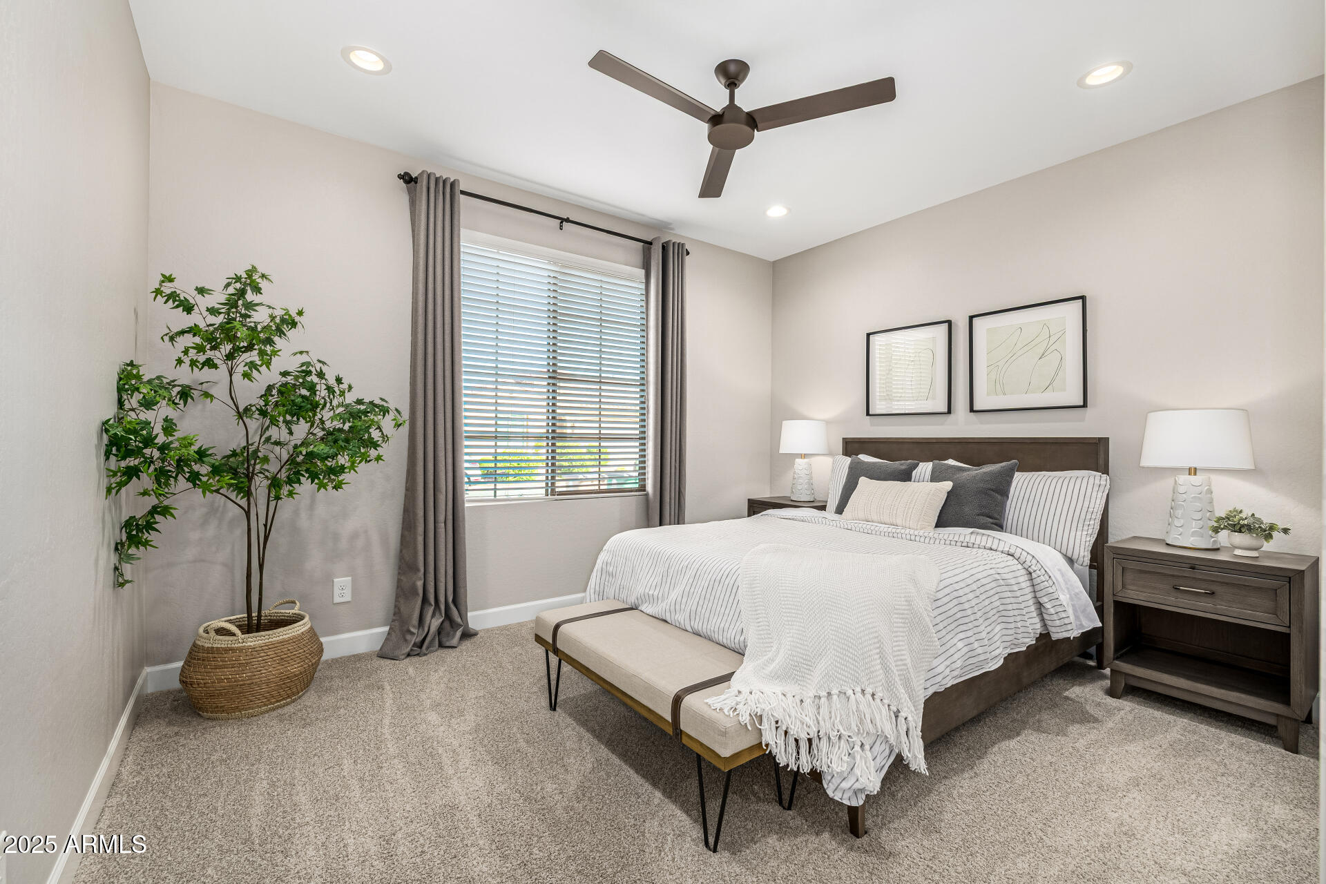 16897 West Merrell Street Goodyear, AZ 85395 - Photo 12 of 21 a spacious bedroom with a bed and a potted plant