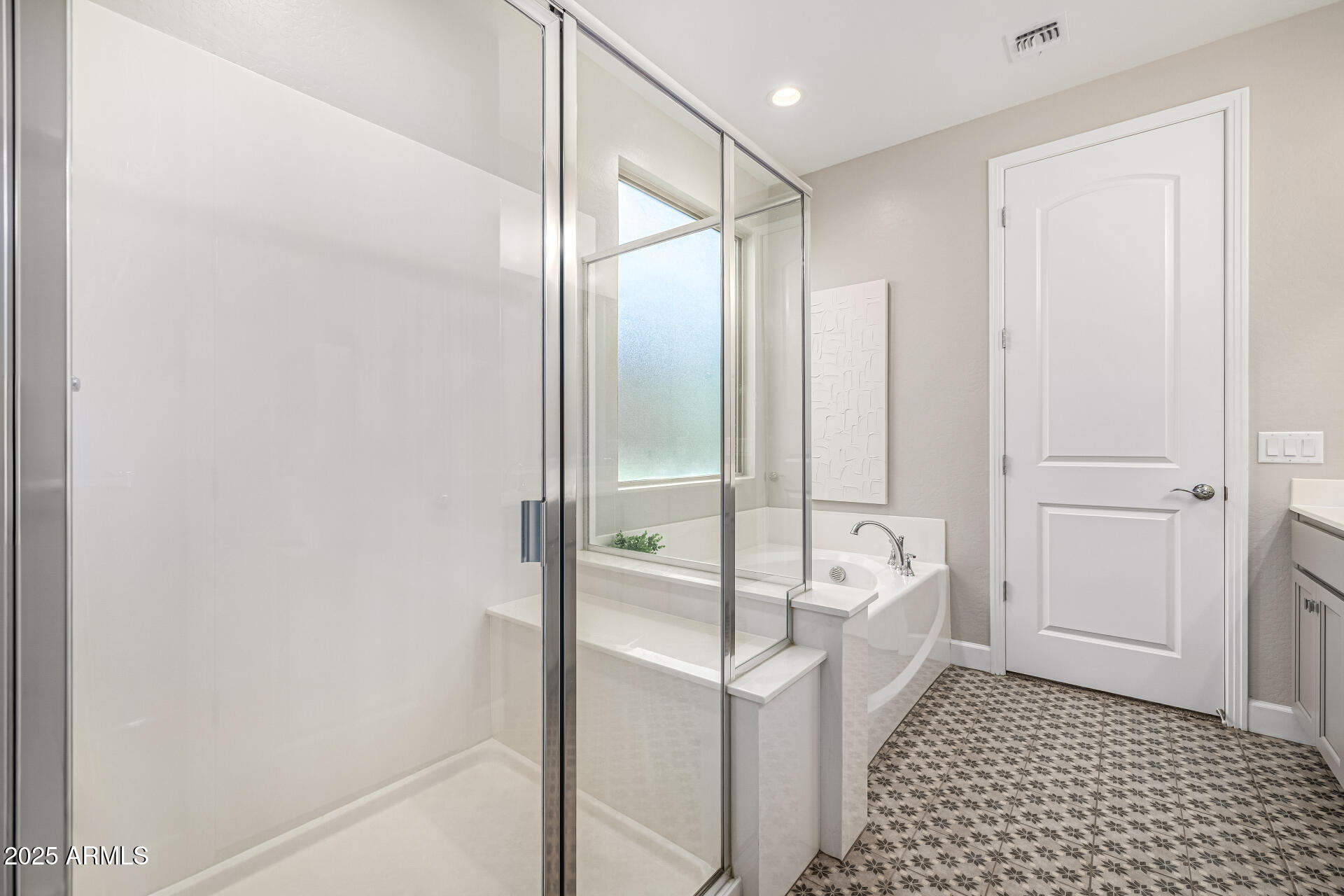 16897 West Merrell Street Goodyear, AZ 85395 - Photo 13 of 21 a bathroom with a bathtub and a shower
