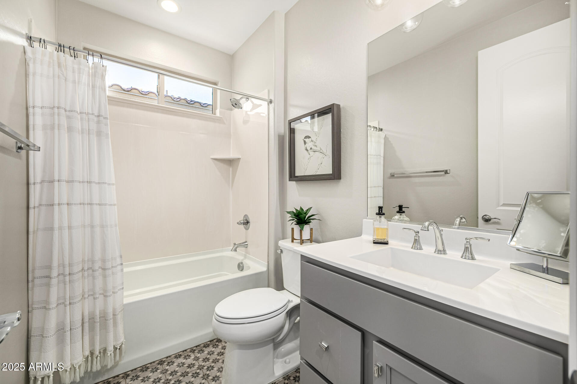 16897 West Merrell Street Goodyear, AZ 85395 - Photo 14 of 21 a bathroom with a sink a toilet and shower