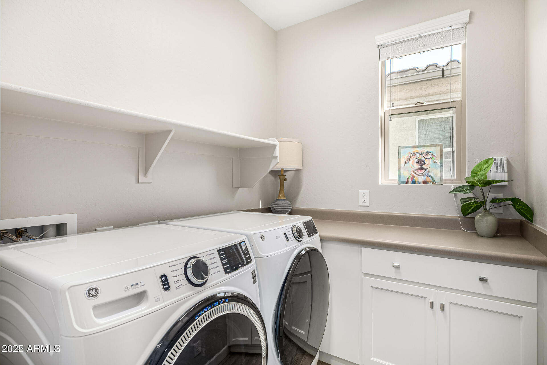 16897 West Merrell Street Goodyear, AZ 85395 - Photo 17 of 21 a utility room with dryer and washer