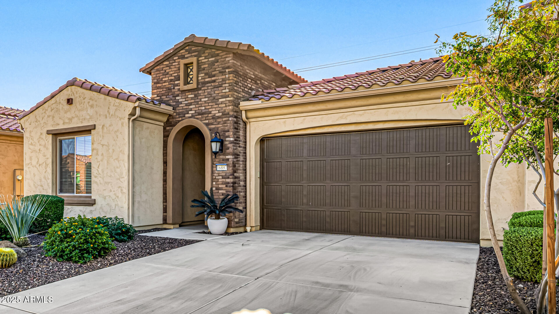 16897 West Merrell Street Goodyear, AZ 85395 - Photo 21 of 21 a view of a house with a door and a fountain