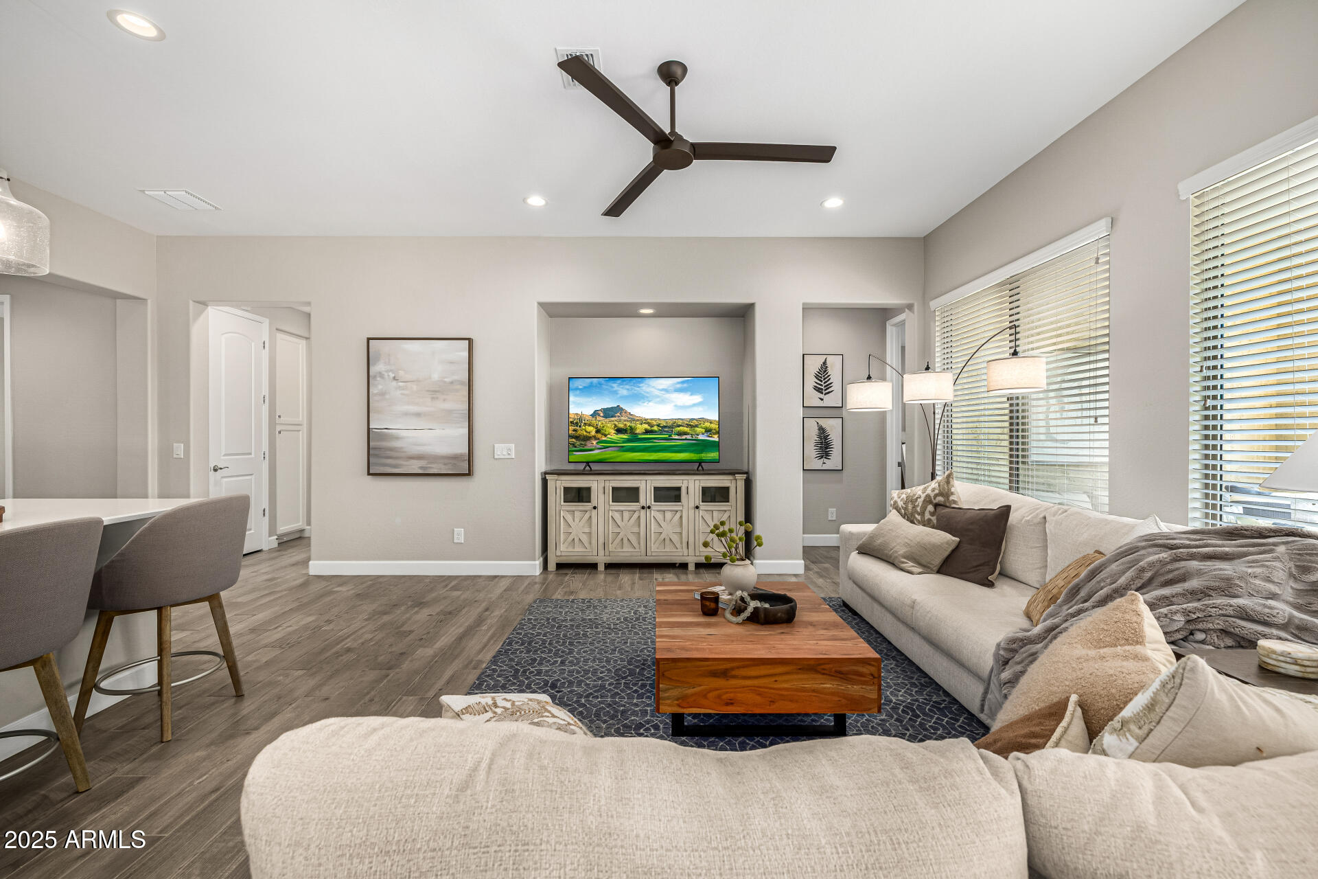 16897 West Merrell Street Goodyear, AZ 85395 - Photo 5 of 21 a living room with furniture and a flat screen tv