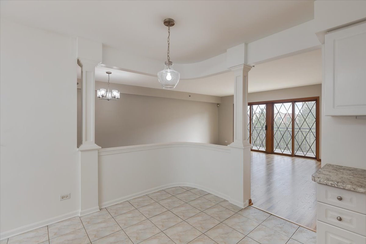 5 South Pine Street, Unit 509 Mount Prospect, IL 60056 - Photo 13 of 31 wooden floor in an empty room with a window