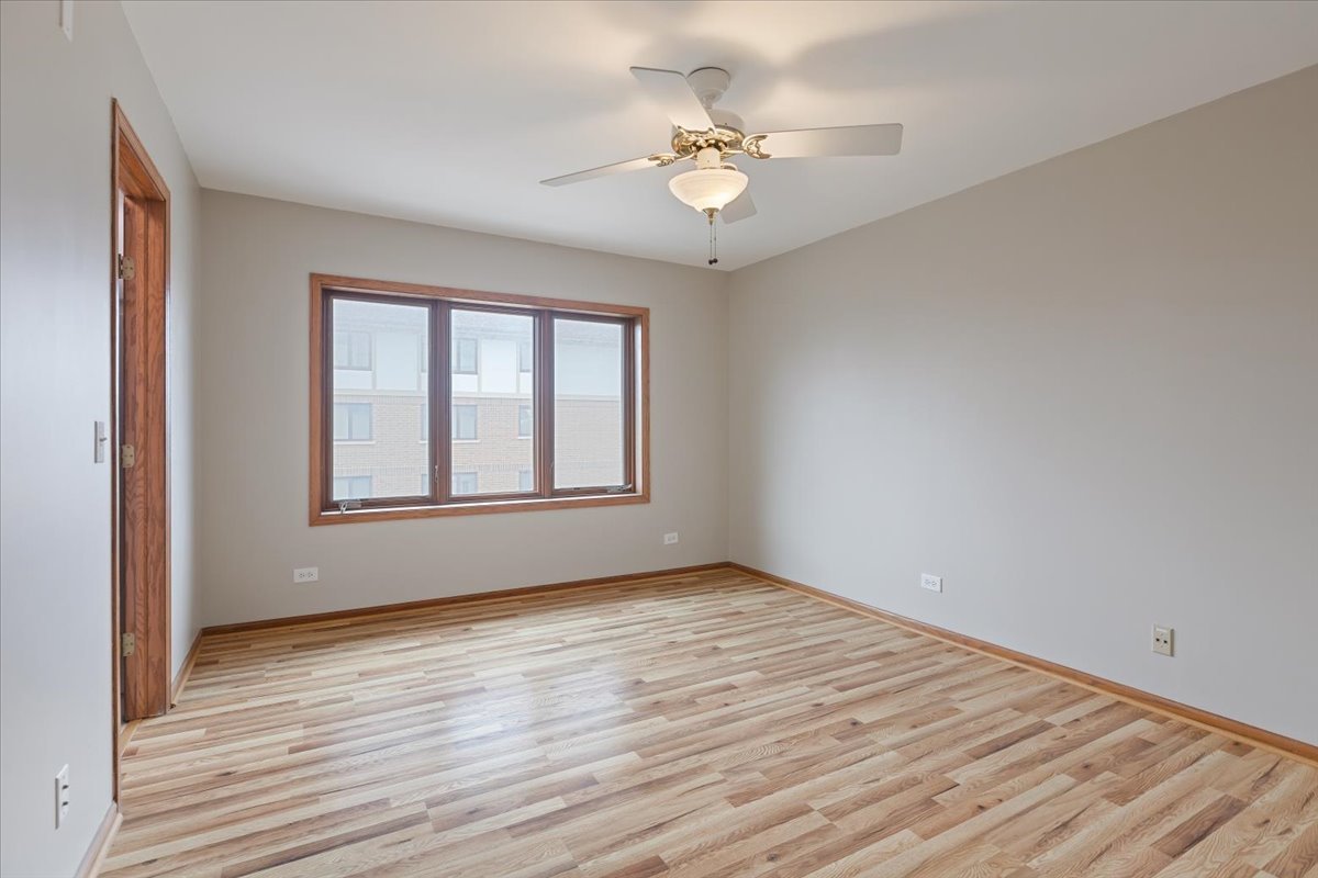 5 South Pine Street, Unit 509 Mount Prospect, IL 60056 - Photo 15 of 31 a view of an empty room with wooden floor and a window