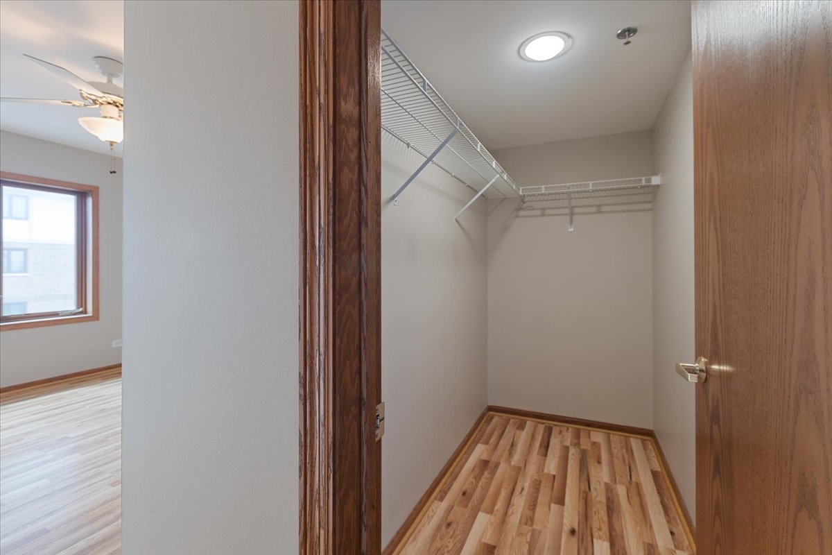 5 South Pine Street, Unit 509 Mount Prospect, IL 60056 - Photo 20 of 31 a view of a room with wooden floor and staircase