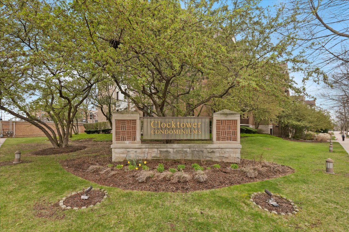 5 South Pine Street, Unit 509 Mount Prospect, IL 60056 - Photo 2 of 31 front view of a house with a yard