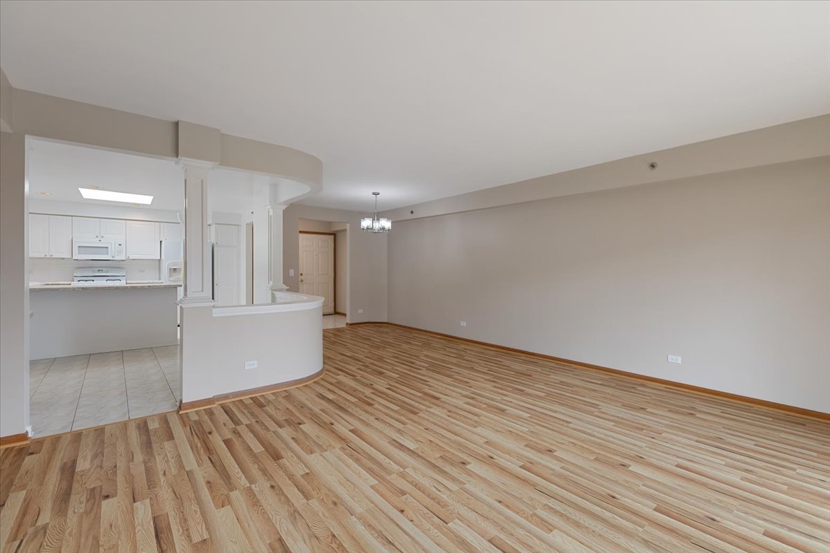 5 South Pine Street, Unit 509 Mount Prospect, IL 60056 - Photo 8 of 31 a view of an empty room and wooden floor