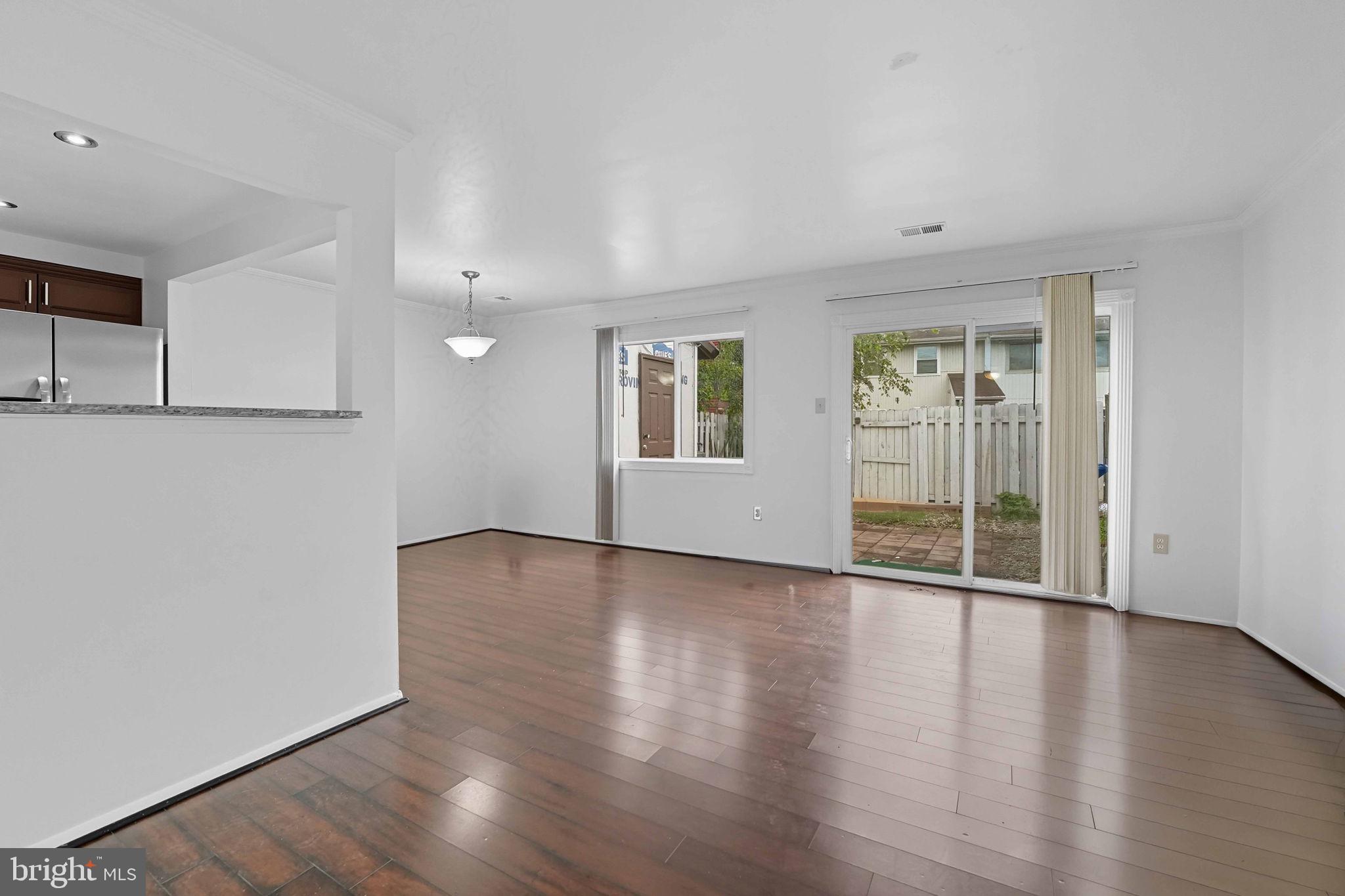 258 North Cottage Road Sterling, VA 20164 - Photo 12 of 33 a view of an empty room with wooden floor and a window