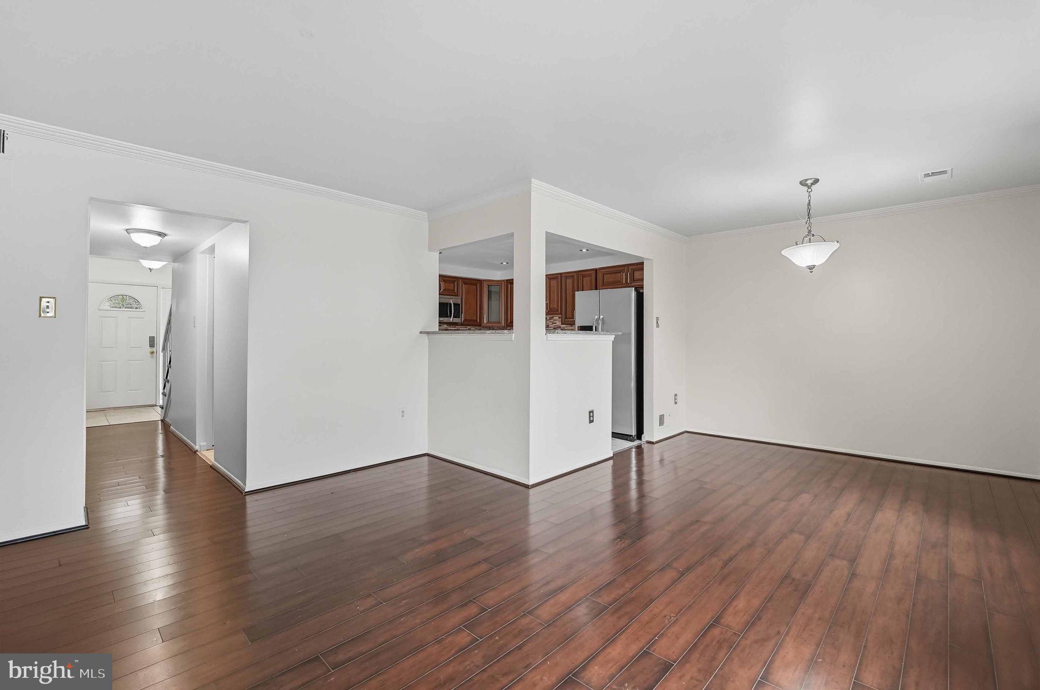 258 North Cottage Road Sterling, VA 20164 - Photo 13 of 33 a view of a big room with wooden floor and windows