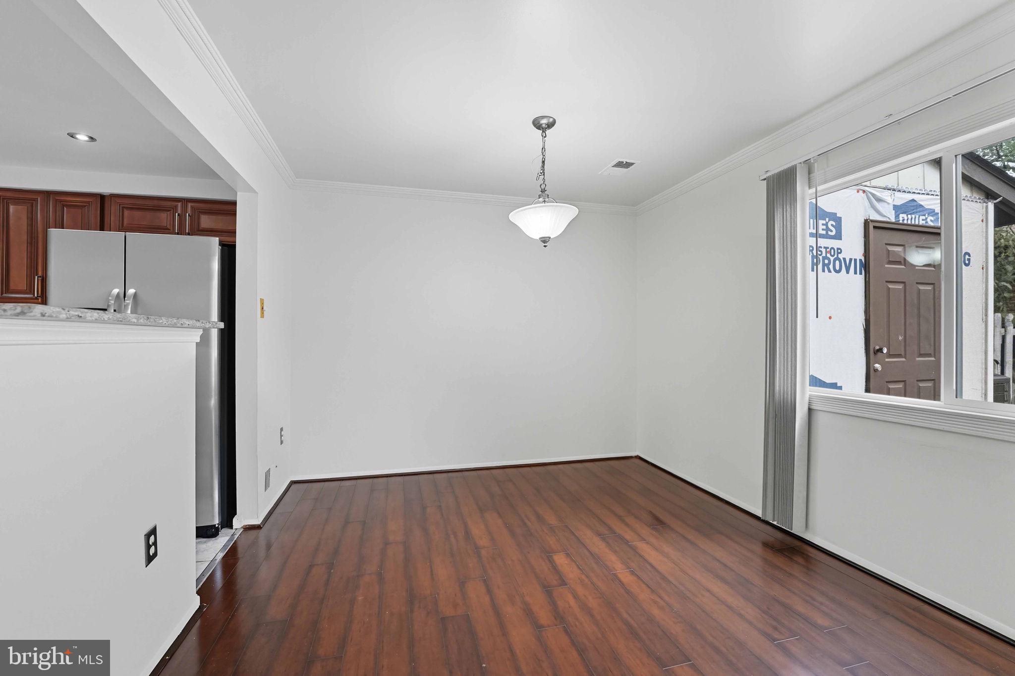 258 North Cottage Road Sterling, VA 20164 - Photo 14 of 33 a view of a room with wooden floor and window