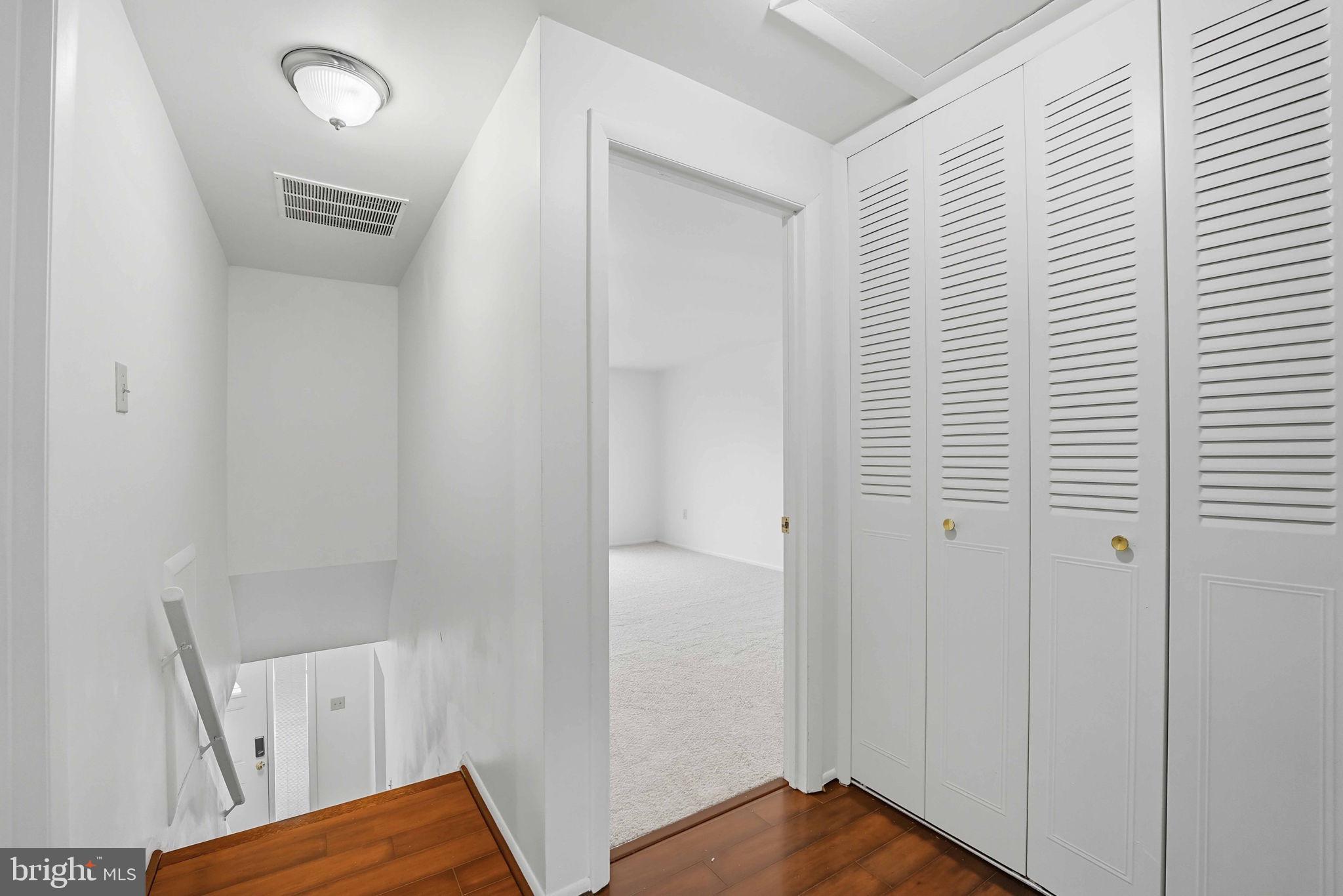 258 North Cottage Road Sterling, VA 20164 - Photo 15 of 33 a view of a hallway with wooden floor and closet
