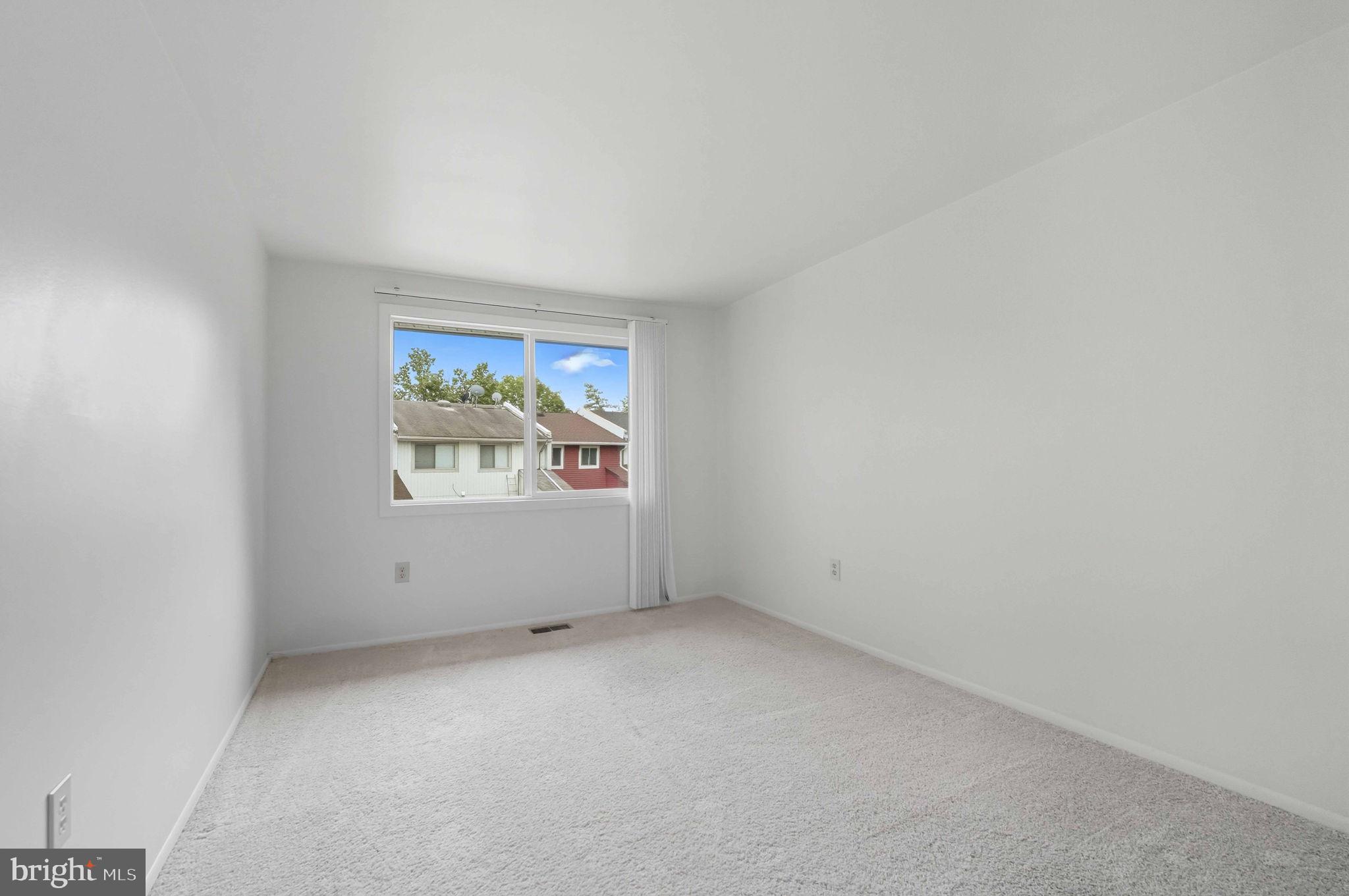 258 North Cottage Road Sterling, VA 20164 - Photo 26 of 33 an empty room with windows