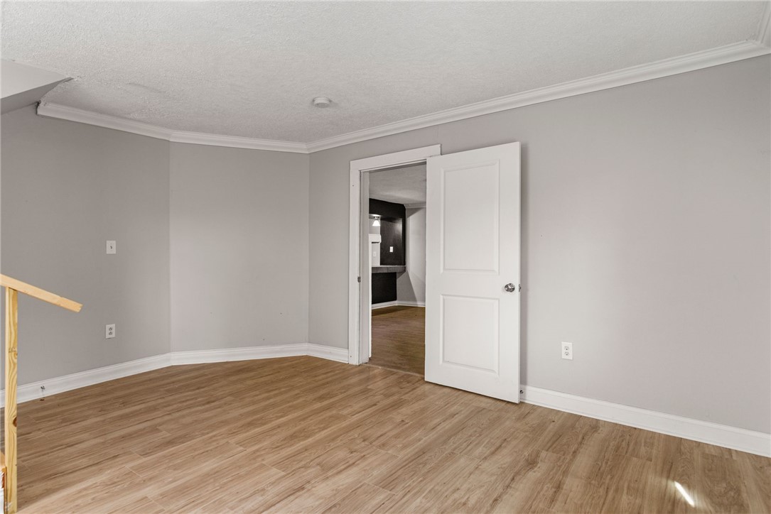 109 Farmer Street Anderson, SC 29621 - Photo 24 of 31 Clean lines and wood-look tile flooring define this flexible living space.