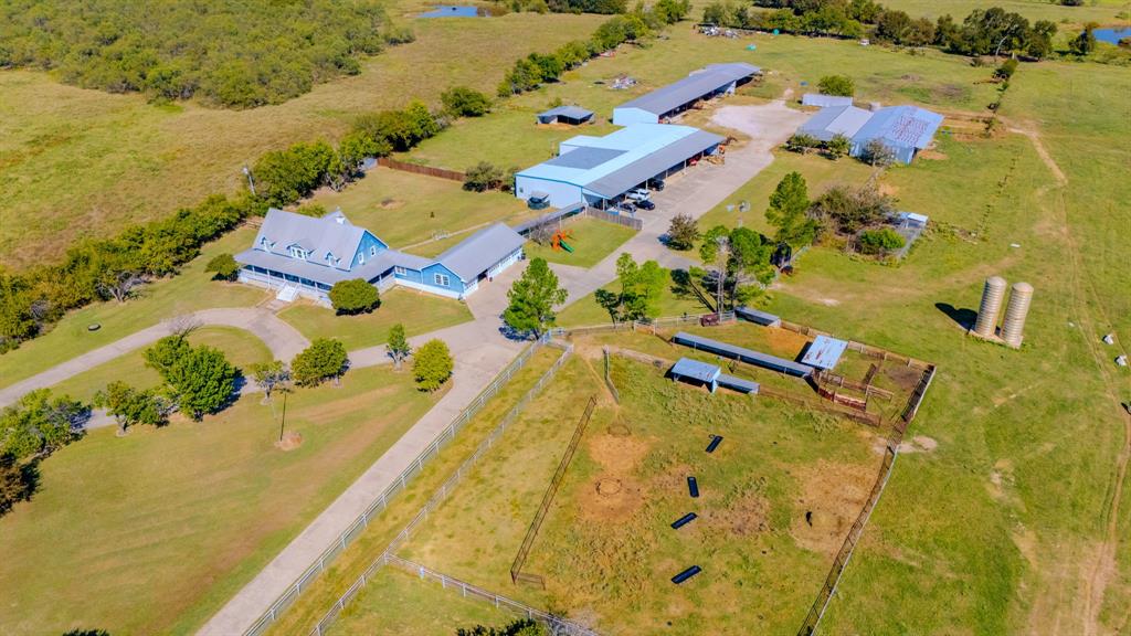 45-acres Strittmatter Road Pilot Point, TX 76258 - Photo 3 of 20 an aerial view of residential houses with swimming pool