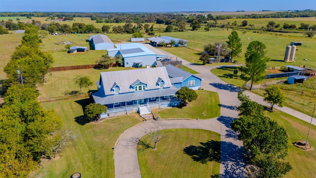 45-acres Strittmatter Road Pilot Point, TX 76258 - Photo 4 of 20 an aerial view of a house with a swimming pool