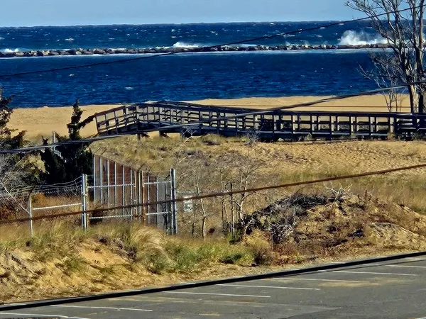 a view of swimming pool with wooden floor